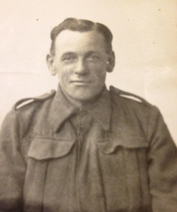 Sepia head and shoulders photograph in uniform
